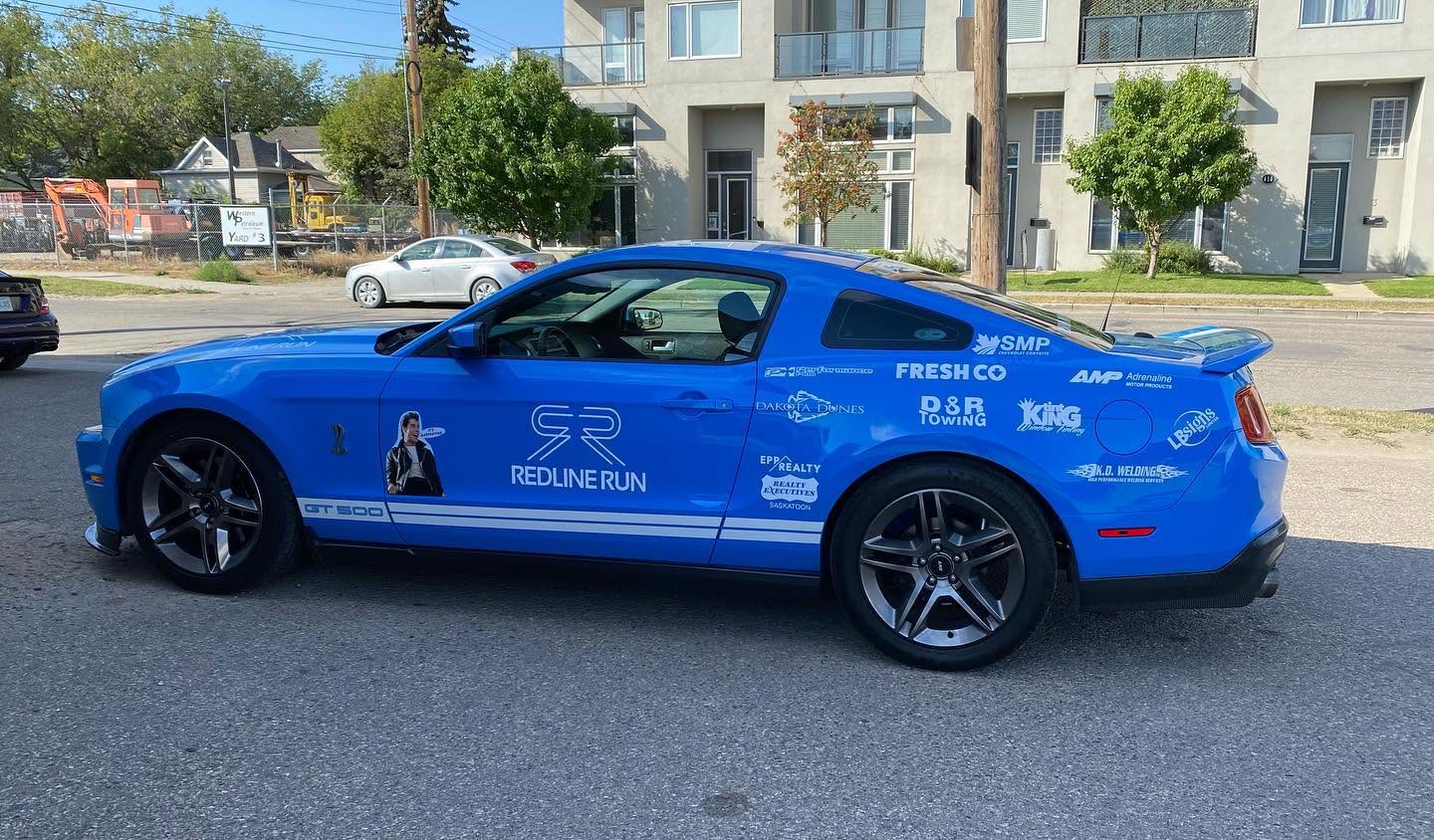 Blue Mustang with custom vehicle lettering